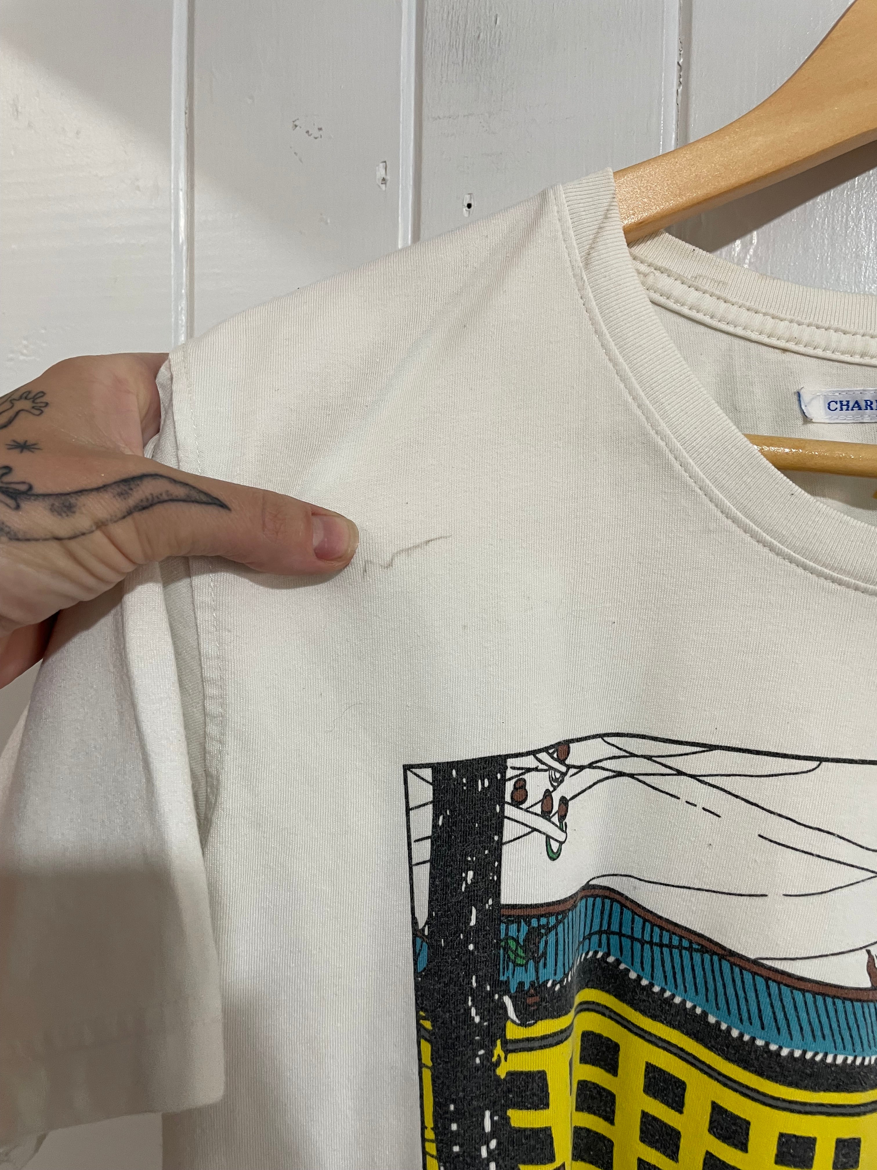 Image of (L) Tin Tin Tee