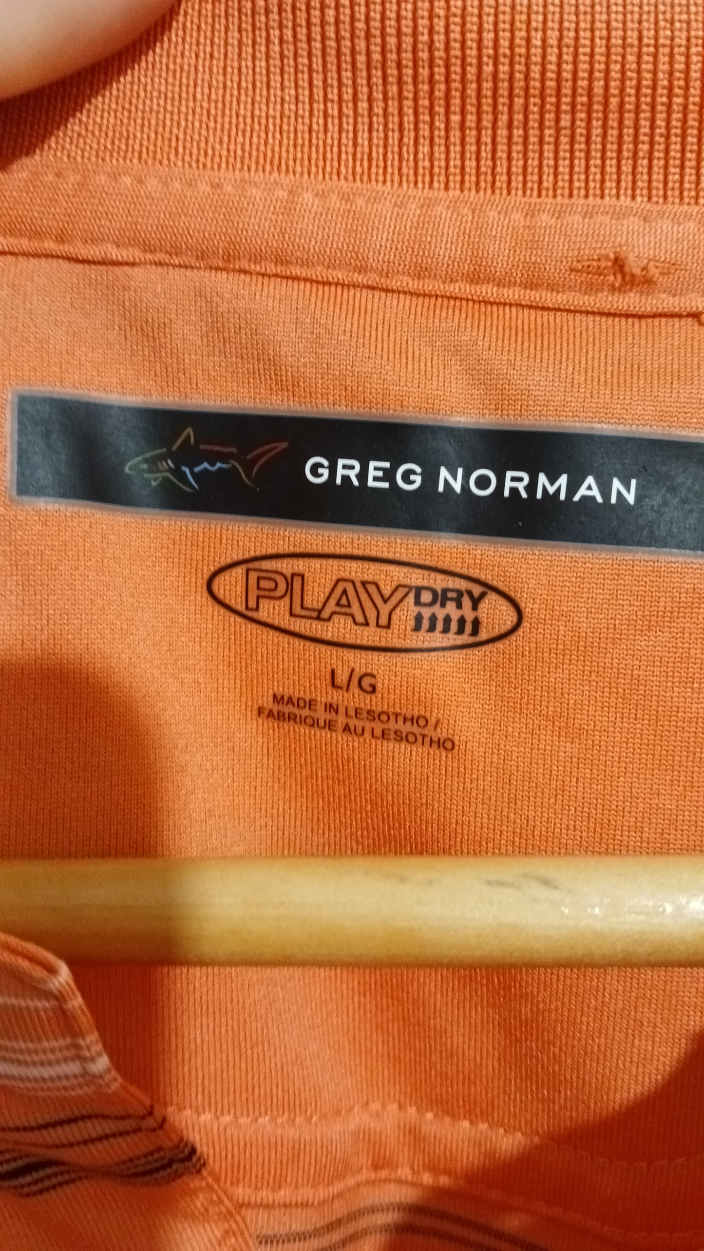 (L) Greg Norman | Orange Striped Polo
